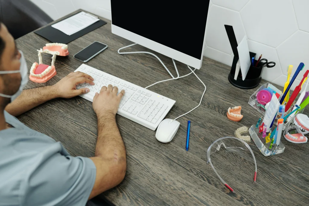 The placeholder dentist marketing image showing a guy working on dental marketing
